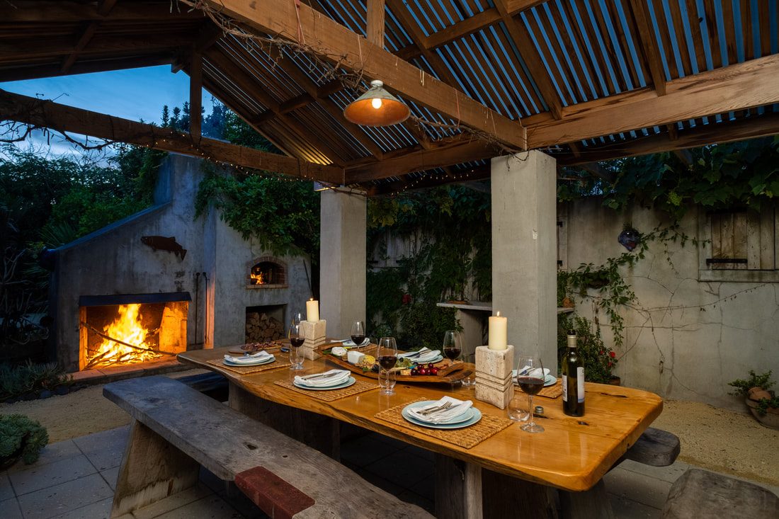 Beach Road cedar outdoor room with open fire by Tim Durrant Design