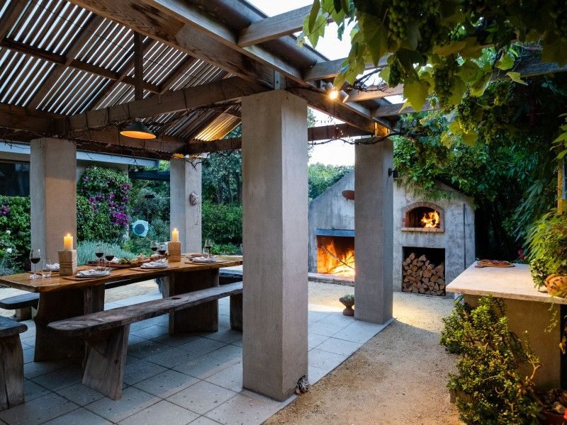 Cedar structure with a rendered Hebel pizza oven, Beach Road, by Tim Durrant Design