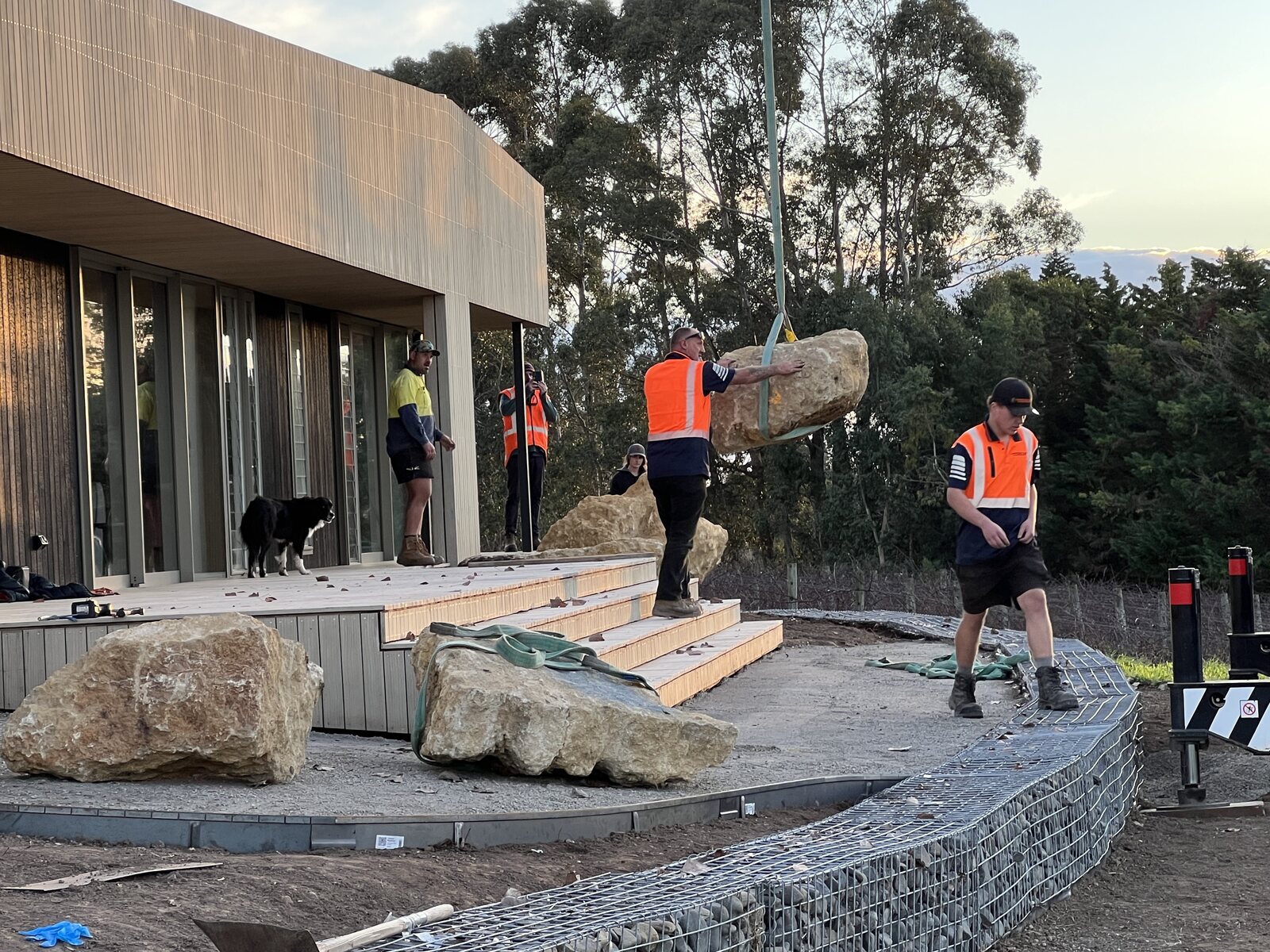 Placing hand-picked boulders and gabion walls