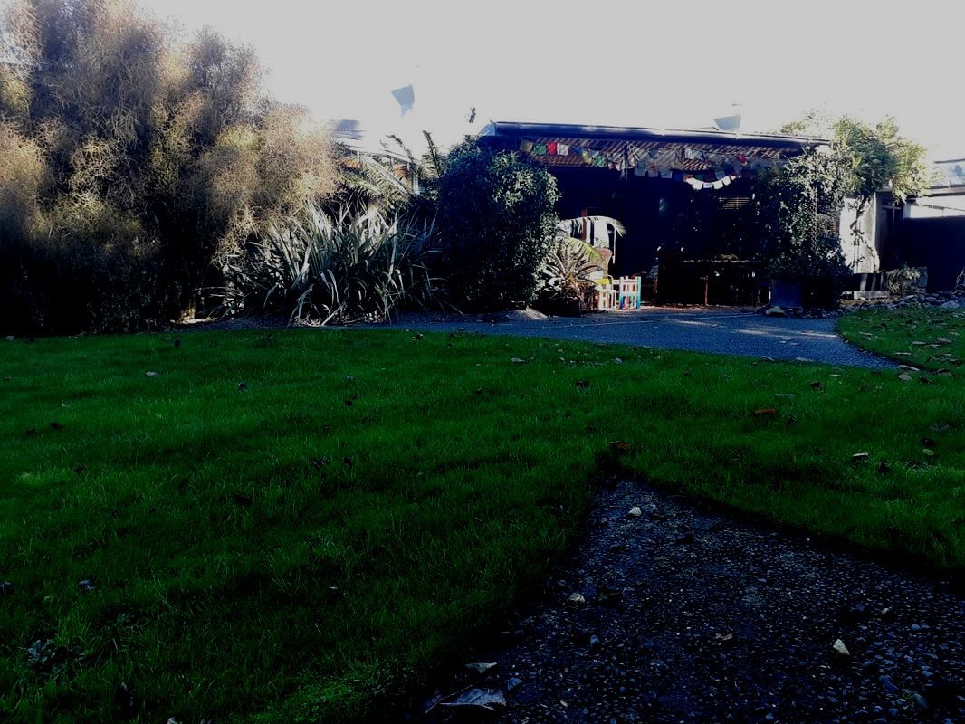 Homestead Garden. Poraiti, Water feature of red rock and soft drawn copper